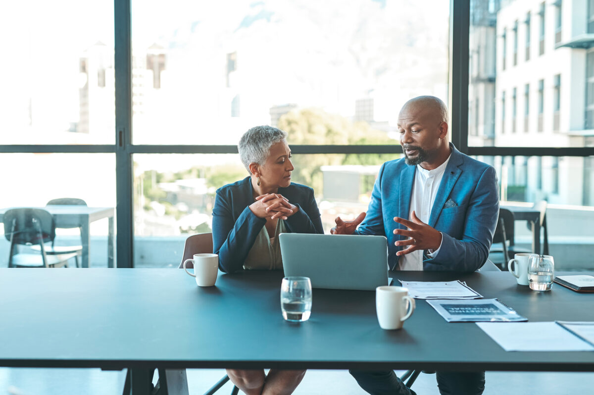 business people in corporate conference room working together to create a b2b content marketing strategy