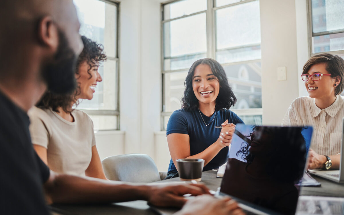 Two colleagues work together to develop their company’s social media branding strategy.